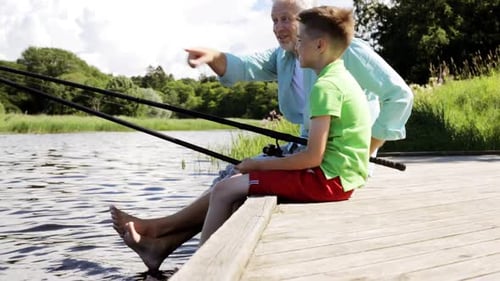 Grandfather and Grandson Fishing on Summer Pier
