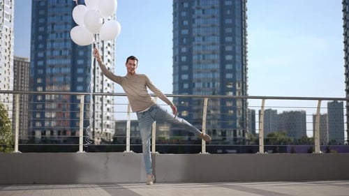 Man Holds Balloons in City, Lifts Leg