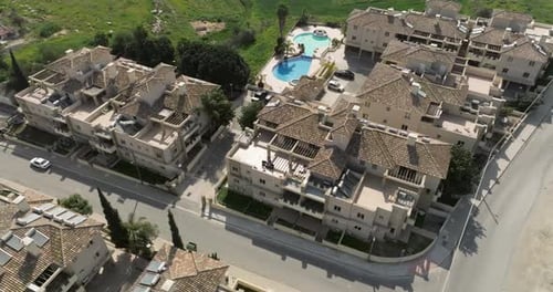 Aerial View of Country Houses with a Swimming Pool in a Green Place