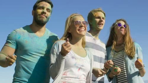 Multi-Ethnic Group of Diverse Young People Dancing in Celebration of Holi Festival. They Have Enorm