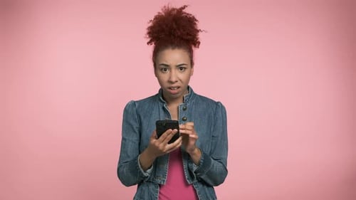 Woman Shocked by Content on her Mobile Phone