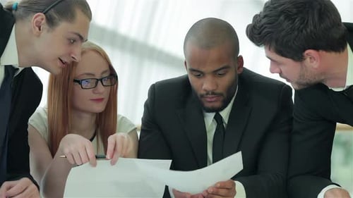 Businessmen Sitting at Table in Office While Discussing Their of Business Doings