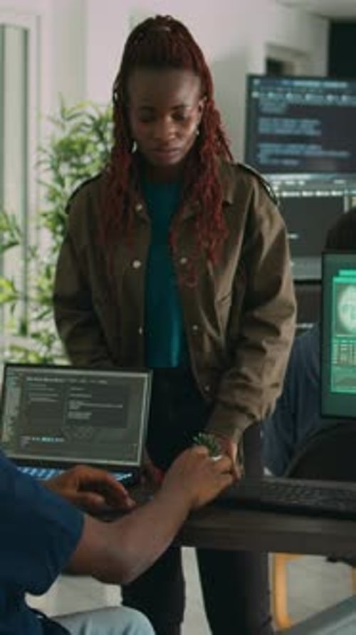 Team Collaborating on Cybersecurity in Modern Office