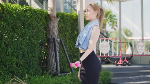 Young Woman Athlete Lifestyle Sport Exercise City Lifting Dumbbell Outdoors Wearing Sport Attire