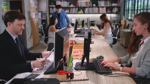 Employees working on computers in the office
