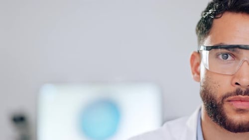 Close-up of Scientist Wearing Safety Glasses in Lab