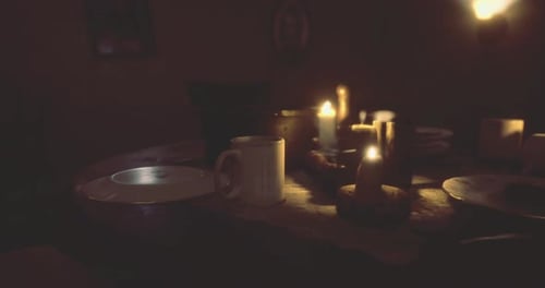 Warm Candles Burning on a Dinner Table