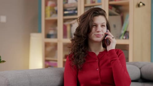 Woman Chatting on Phone in Living Room