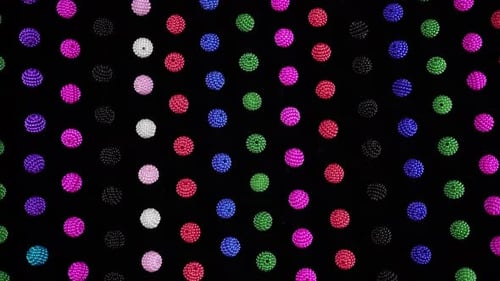Bright Small Beads On Dark Background Top View.