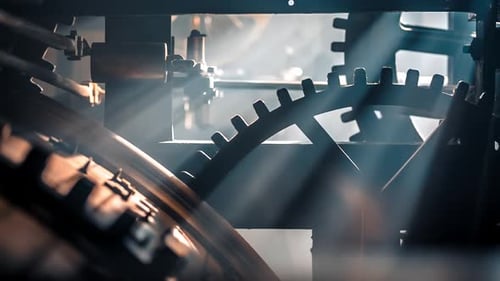 Clock Gears Turning with Light Shining Through