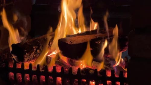 Burning Fireplace with Orange Flames in a Cozy Home