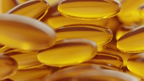 3d rendering motion close up. Fatty fish oil supplements. Soft gelatin capsule