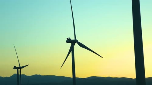 Wind Turbines Silhouetted at Sunset