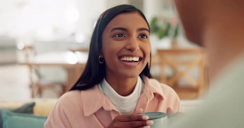 Smiling Woman Chatting with a Mug Indoors