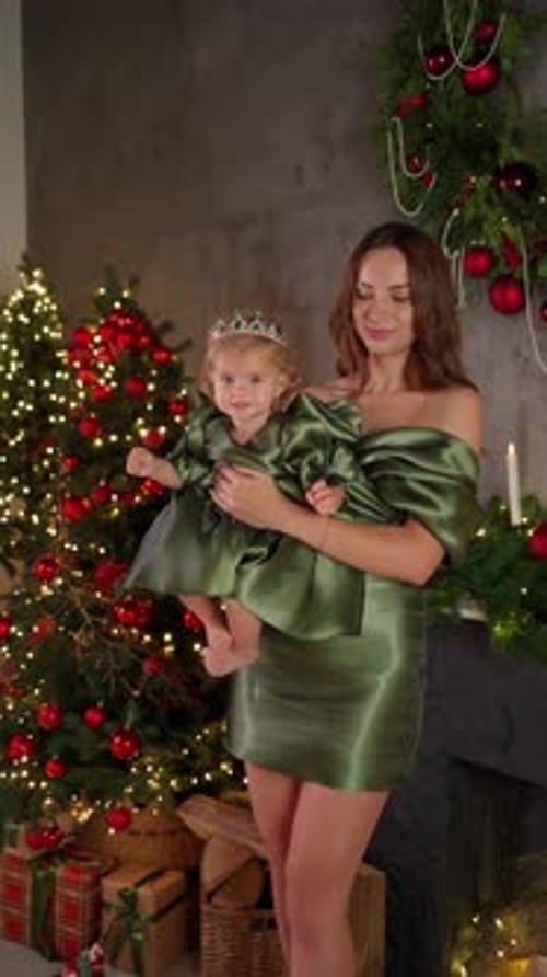 Smiling Mother Holding Little Daughter Near Decorated Christmas Tree Family Christmas Celebration