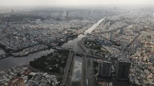 Ho Chi Minh City, Vietnam. Aerial View of Modern Metropolis Buildings, Bridge Traffic and Air Pollut