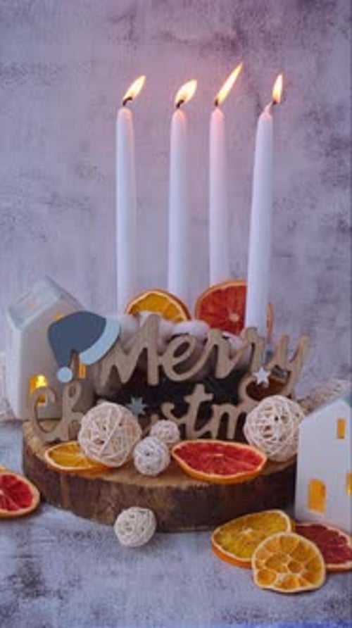Traditional Burning Christmas Wax Candles with Numbers Counting Down for Christmas Four Advent