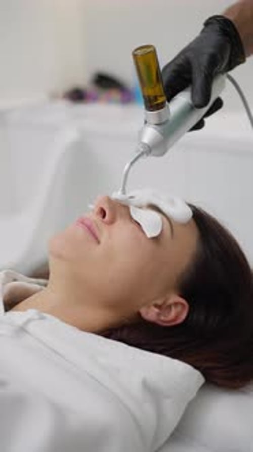 Woman Receives Facial Skincare Treatment in Hospital