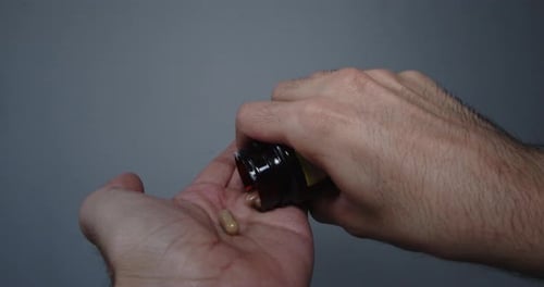 Hand Dispensing Capsules from a Bottle