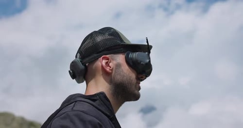 Drone Pilot Outdoor Wearing DJI Avata 2 FPV Goggles. closeup shot