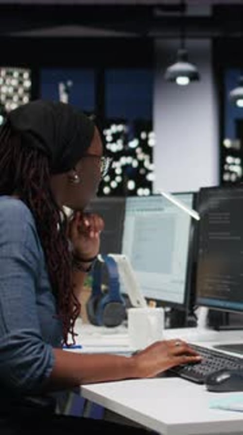 Vertical Video Panicked Female Engineer in Office Requests Help From Colleagues to Block Hacker