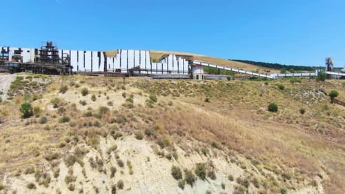 Ruined and abandoned factory building on hill