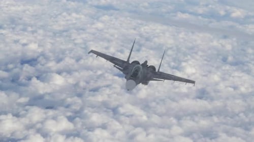 Modern Fighter Jet Flying Above White Clouds