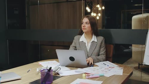Young Woman Working At Table On Laptop