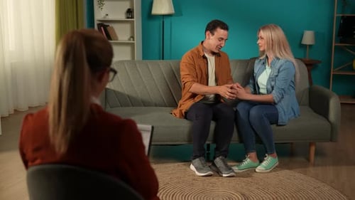 Happy Couple Holding Hands in Therapy Session