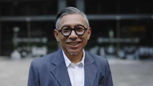 Smiling Adult Man in Blue Blazer