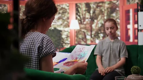 Child Talking With Adult in a Living Room