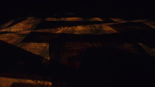 Low Angle Dolly Over Pile of US Dollars