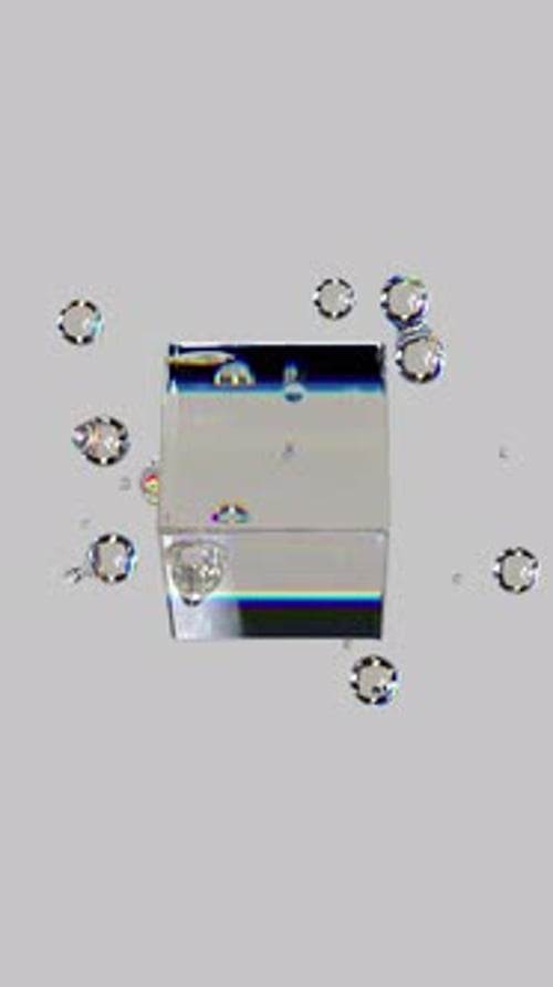 Metaball liquid transparent iridescent blobs with rotating cube.