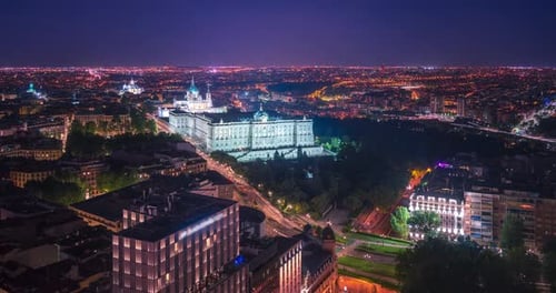Timelapse of Madrid Royal Palace and Almudena Cathedral at night. Seen from the top of the Hotel RIU