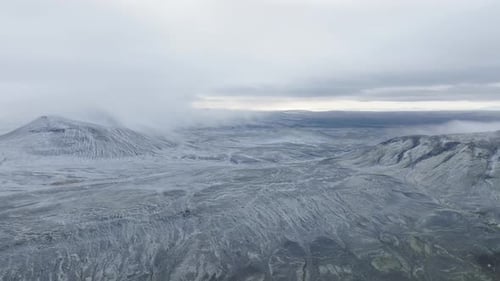 Aerial video of an area covered with ice and snow in the highlands in Iceland