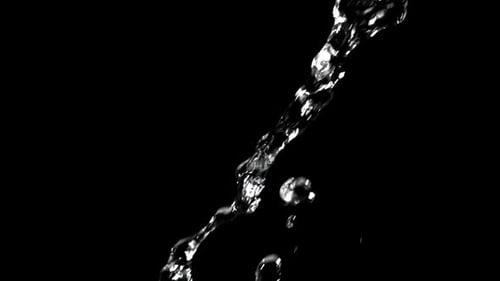 Water stream flowing on black background for compositing