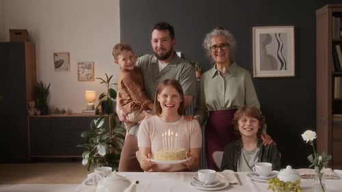 Happy Family Celebrating a Birthday Together at Home