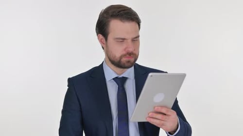 Man in Suit Reacting to Tablet News