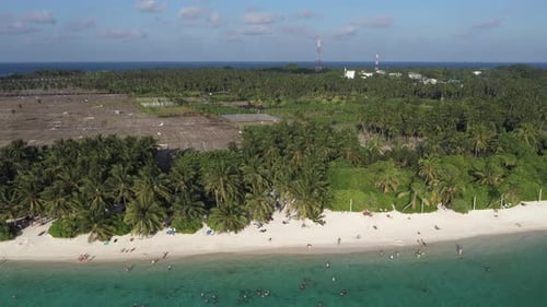 Aerial view of tropical beach with turquoise water, Maldives.