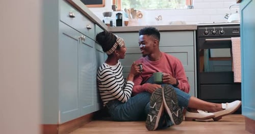 Affectionate Couple Relaxing in Kitchen Together