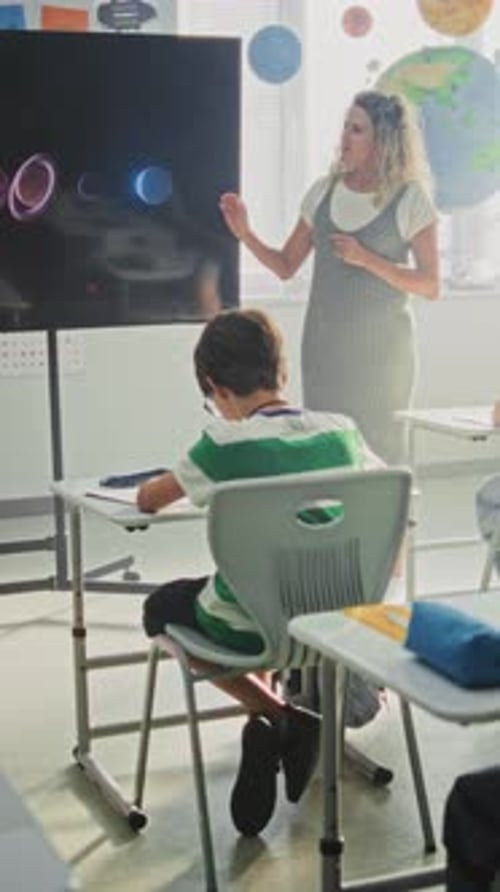 Elementary School Students Studying Basic Information About Solar System and Planets