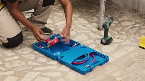 Person Unpacking Professional Tools for Repair Work, Nature Stock ...