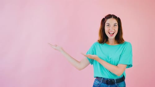 Woman Smiling and Presenting to the Left