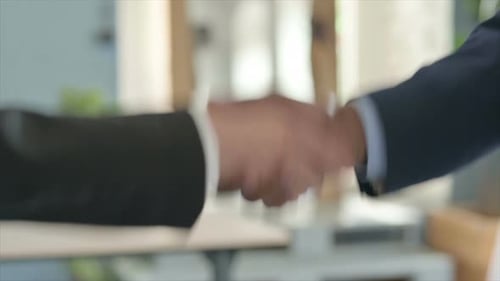 Slow Motion of Handshake of Young Business People