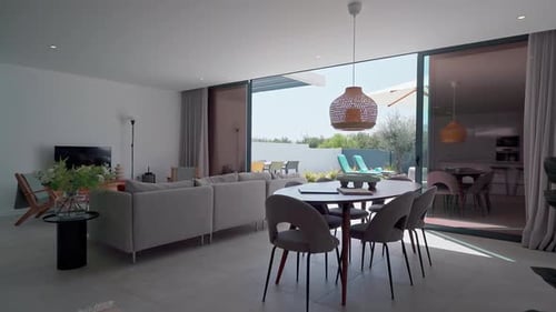 Contemporary Living Room Bathed in Natural Light Featuring Stylish Dining Area Comfortable Sofa and