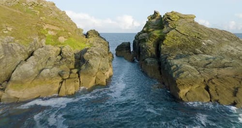 Rocky Coast Line Aerial View Sumer Clouds Over Ocean Waves