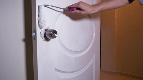 Man Paints Wooden Door White 4K