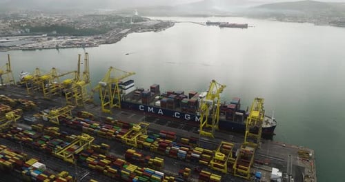 Aerial view of cargo ship at port, Italy.