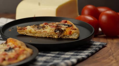 Slice of Homemade Pizza on Plate with Cheese