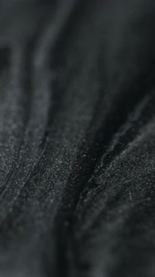 Dark Rippled Abstract Texture Close-Up Background
